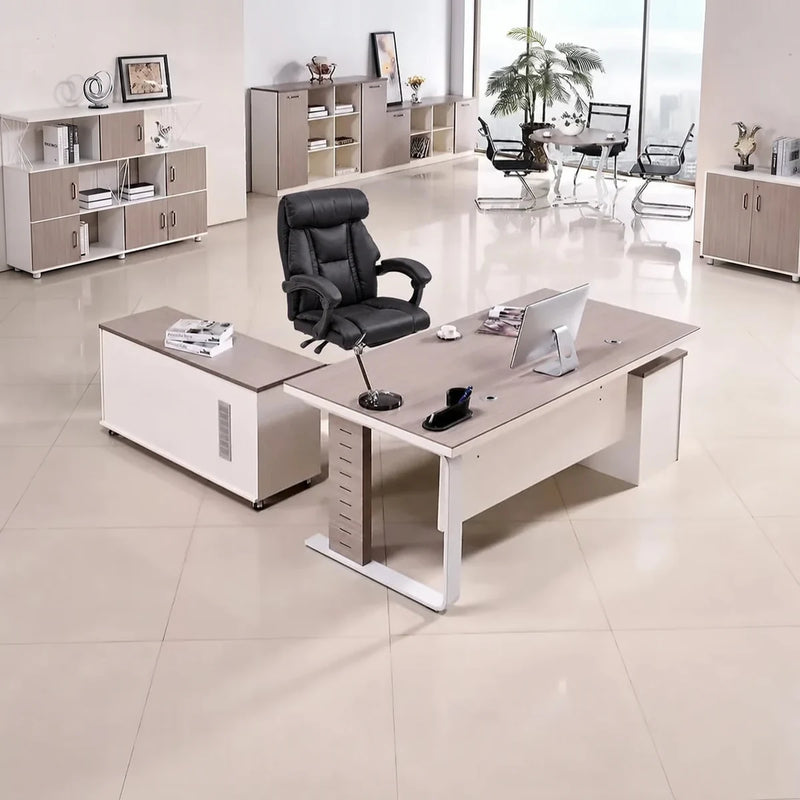 Vesper manager desk with base return in a bright showroom office