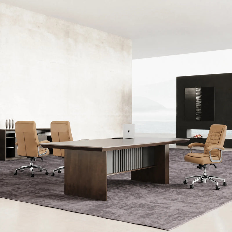 Westmere executive conference table with three tan chairs facing a wall-mounted screen