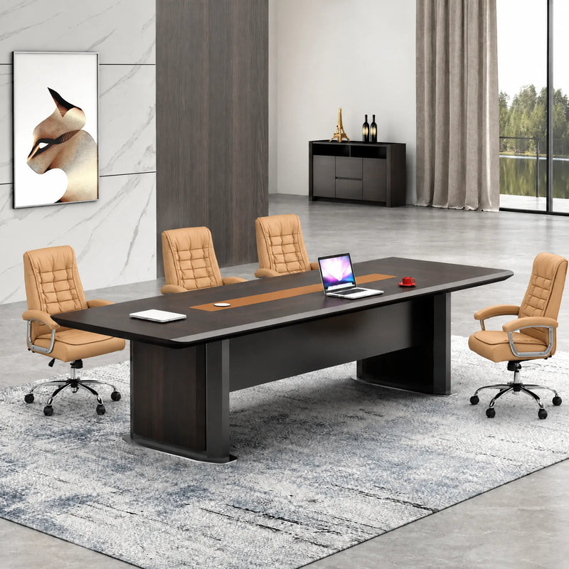 Winslow 11′10″ (142-inch) conference table seating 12 with a laptop and orange chairs