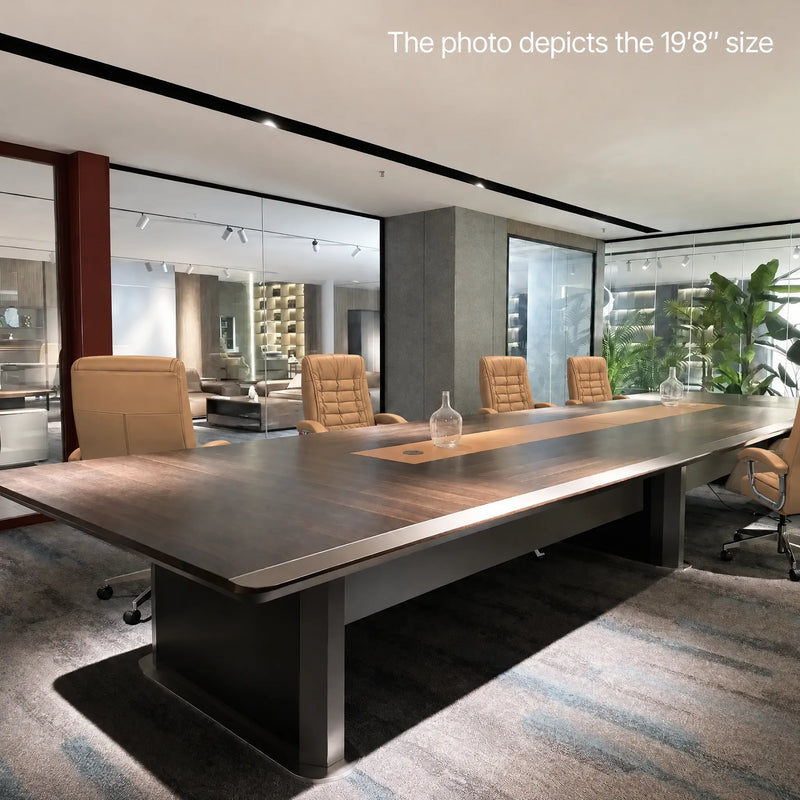 Winslow 19′8″ (236-inch) conference table photographed in a showroom with cream chairs