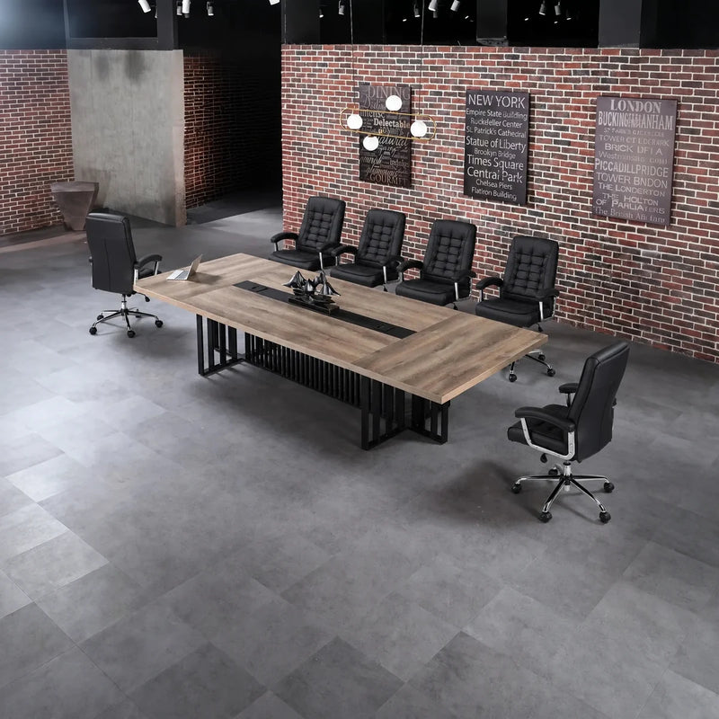 Wright large conference table with black chairs in a loft office with an exposed brick wall