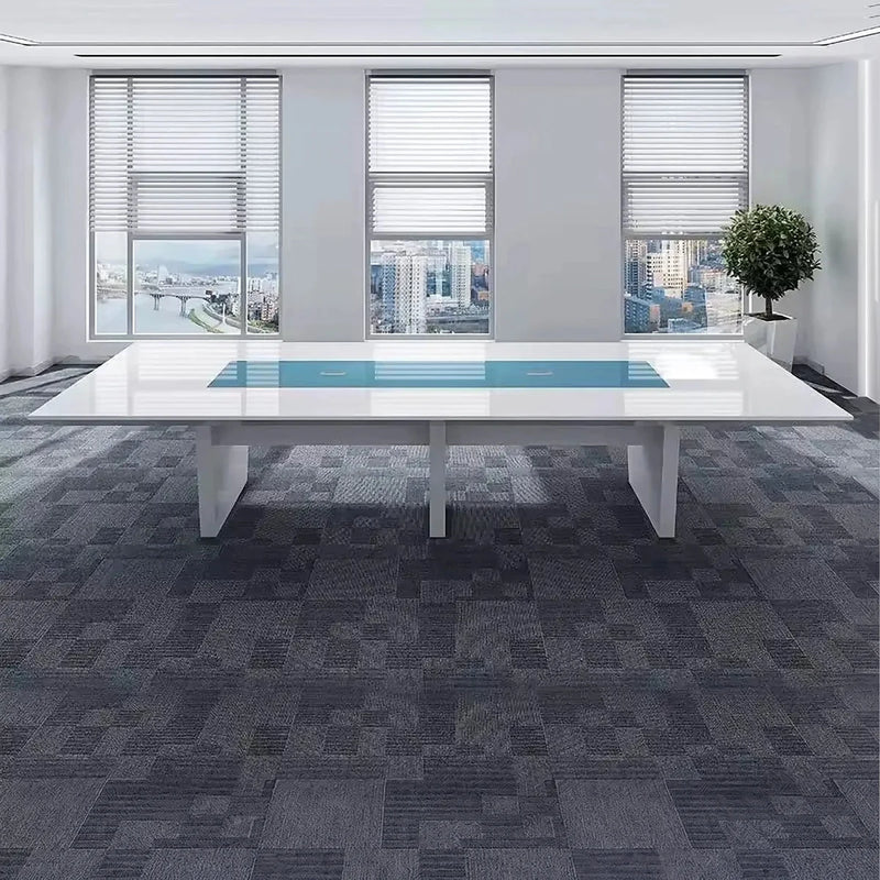 Forum white high-gloss conference table in a corner office with window blinds and carpet tiles