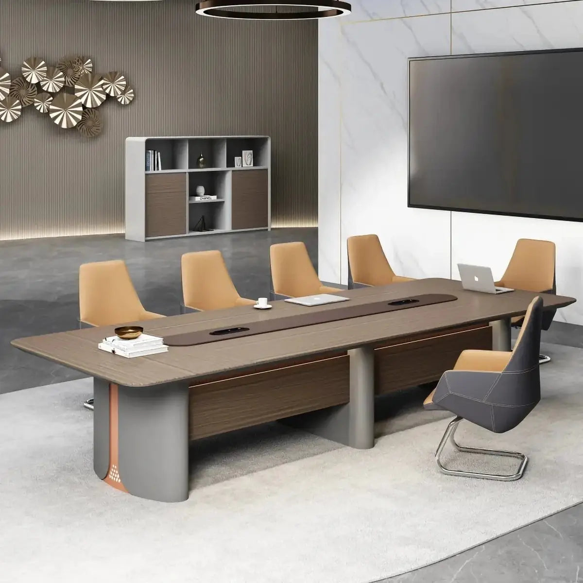 Conference table in a boardroom with a TV wall