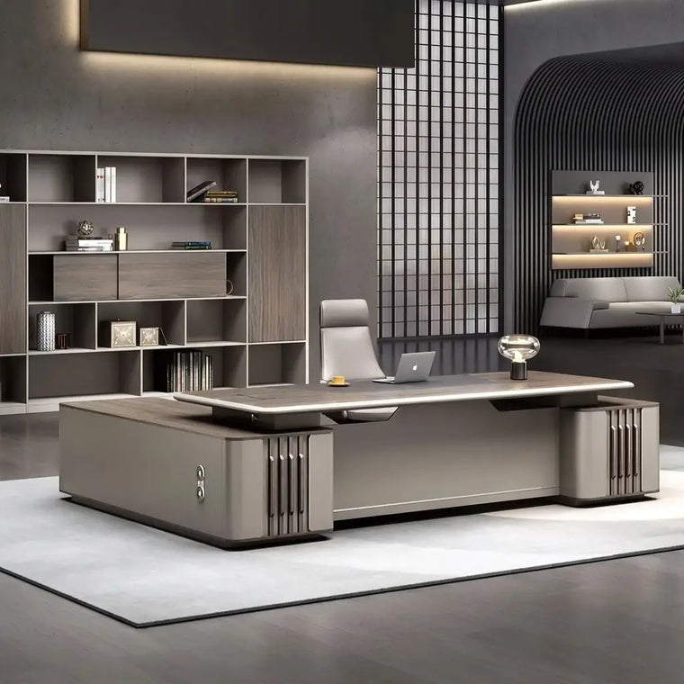 Large L-shaped executive desk in the command position with a bookshelf wall behind, in a dark modern office