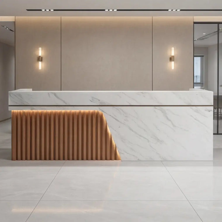 Marble front reception desk in a bright, welcoming lobby