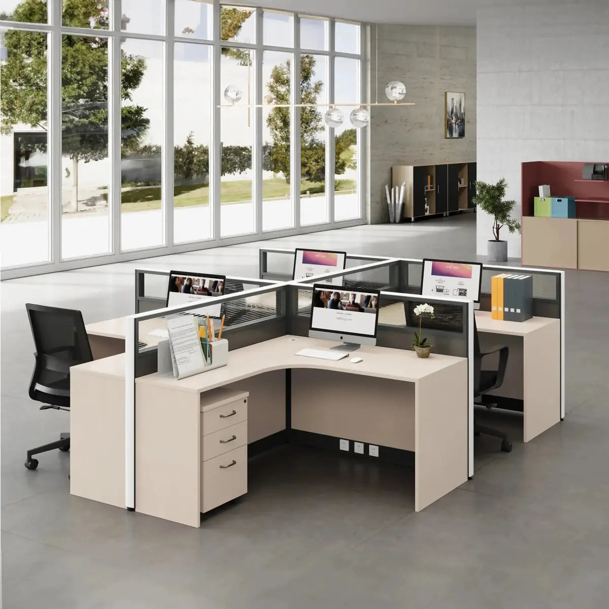 Beige L-shaped cubicle workstation cluster by an office window