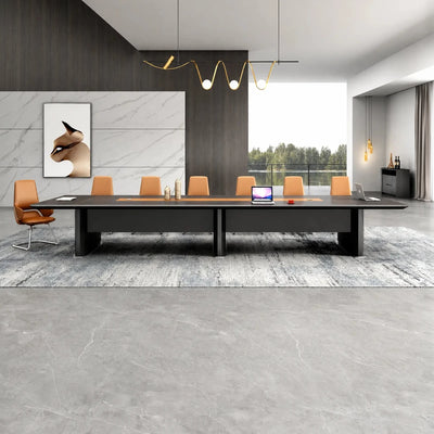 Winslow massive dark woodgrain boardroom table with orange chairs beneath a brass pendant, viewed straight on