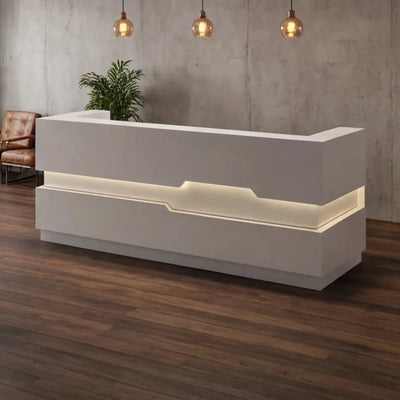 Eris front desk under industrial pendants in a loft lobby