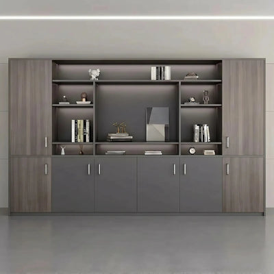 Loxley office bookcase front view in a room, gray oak frame, open shelves with books and dark gray doors