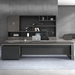 Acumen grand executive desk in gray oak stretching across a modern office wall