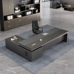 Acumen L-shaped desk in gray oak in a corner office, viewed from above