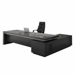Acumen modern desk in gray oak and black, right return, on a plain studio background