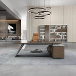 Aldiss desk with right return in a high-ceiling executive office with ring pendants