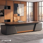 Alford executive desk from the visitor side, in front of a walnut and leather wall unit