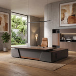 Alford executive desk in a concrete courtyard office with a garden window beside its matching shelving