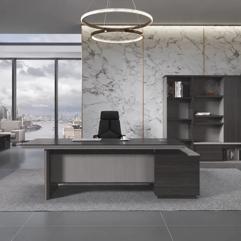 Allard executive desk, left return, beneath a ring chandelier in a marble executive office