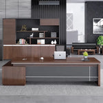 Altona executive desk in walnut and gray in a dark-paneled loft office