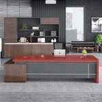 Altona desk with red desktop over walnut base in a furniture showroom