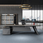 Alwin executive desk facing the window wall in a moody skyline office