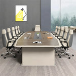 Alwyn briefing table in walnut with cream leather high-back chairs on a woven rug