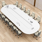 Angled overhead view of the Amica white conference table with 12 chairs and flip-up cable grommets