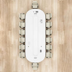 Top-down view of the Amica white racetrack conference table seating 14 on a wood floor