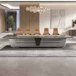 Amiens executive boardroom table with tan leather chairs against a black stone feature wall