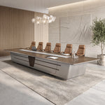 Amiens conference table with six tan leather chairs on a gray rug, angled from the corner