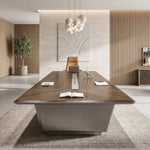 Amiens conference table viewed from the end, showing the tapered gray base and center charging panel