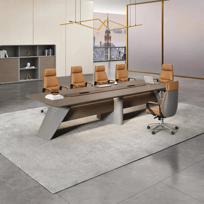 Amity conference table close up, showing the brown center inlay, gray wedge legs and a laptop