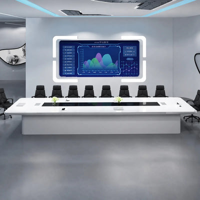 Amix white boardroom table with orange chairs facing a wall-mounted dashboard screen in a futuristic office