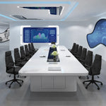 Amix white conference room table seating 12 in orange leather chairs, viewed from the head of the table