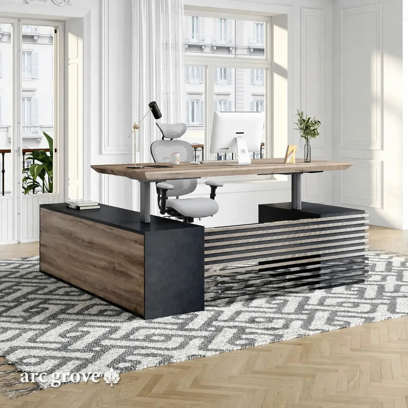 Anderson height adjustable desk raised to standing position in a bright parquet-floor office