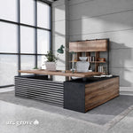 Anderson executive desk at sitting height with matching wall shelf in an industrial office