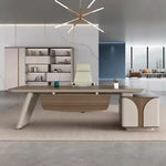 Archer executive desk on a woven rug, sculpted blade leg forward