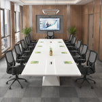 Ardyn large white conference table seating 12 beneath a ring pendant light, facing a wall display