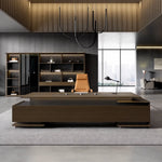 Aspen executive desk with brass underline in a dark-paneled CEO office
