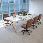 Astrid white high-gloss huddle table with six tan chairs and a laptop by floor-to-ceiling windows