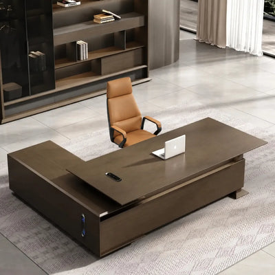 Atlee executive desk with right return and cognac chair in a bright gallery office