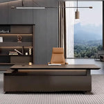 Atlee desk under a linear pendant with mountain views beyond