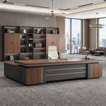 Mahogany August desk with right return facing a wall of curated shelving