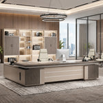Cream August desk with right return and brown leather chair in a high-rise office