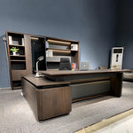 Photo of the Brontë desk assembled in a blue-walled office