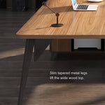 Close-up of the Caelum desk's slim tapered metal legs