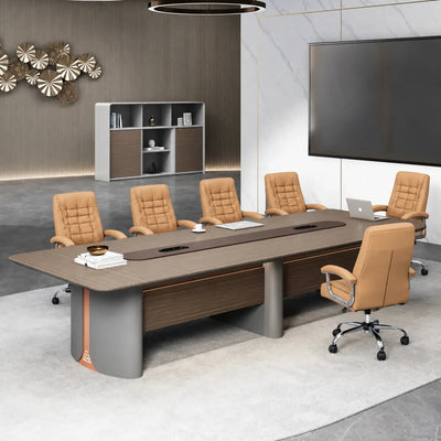 Callum corporate boardroom table with tan leather chairs, a wall-mounted TV and white stone feature wall