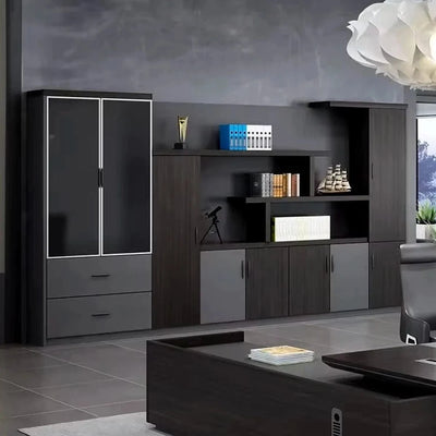 Wexford office wall unit beside an executive desk and chair, dark oak with gray doors and a glass display cabinet