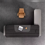 Top-down layout of the Canon L-shaped desk with laptop on the return