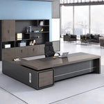 Carlaw desk in gray oak in a blue-walled CEO office with storage wall