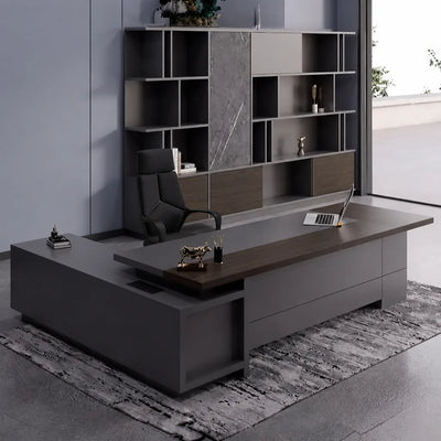 Carwin desk in dark walnut, right return, against a marble shelf wall