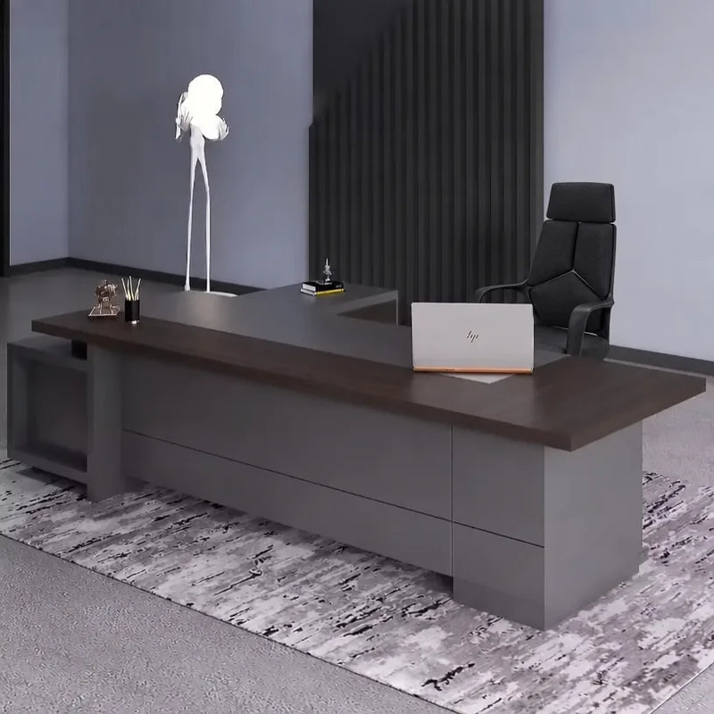 Carwin desk with laptop under a sculpted white pendant